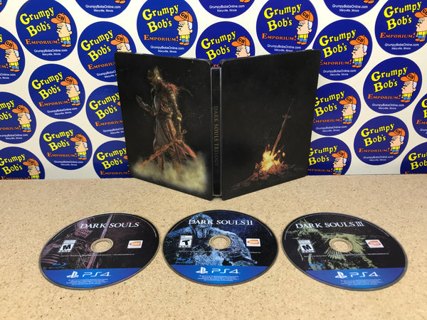 Dark Souls Trilogy (Playstation 4) Pre-Owned w/ Steelbook Case (As Pictured)