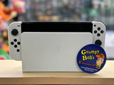 System - OLED Model (Nintendo Switch) Pre-Owned  w/ 2 White Joy-Con Controllers w/ Wrist Straps & Comfort Grip + Dock, HDMI, AC Adapter, and Box (In Store Sale and Pick Up ONLY)