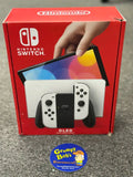 System - OLED Model (Nintendo Switch) Pre-Owned  w/ 2 White Joy-Con Controllers w/ Wrist Straps & Comfort Grip + Dock, HDMI, AC Adapter, and Box (In Store Sale and Pick Up ONLY)