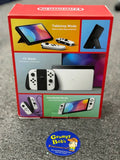 System - OLED Model (Nintendo Switch) Pre-Owned  w/ 2 White Joy-Con Controllers w/ Wrist Straps & Comfort Grip + Dock, HDMI, AC Adapter, and Box (In Store Sale and Pick Up ONLY)