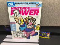 Nintendo Power: Volume 212 / February 2007 "Wario Ware: Smooth Moves" Cover & Poster (Magazine) (As Pictured) Pre-Owned w/ "Super Monkey Ball: Banana Blitz" Poster + Pokemon Mystery Dungeon Comic