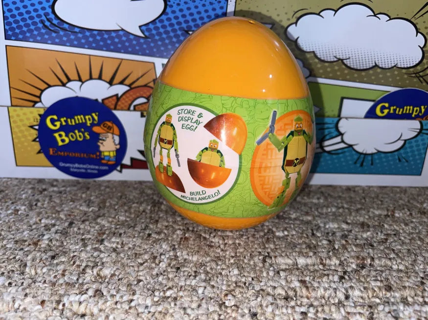 Teenage Mutant Ninja Turtles: Build-It-Michelangelo w/ Store & Display Egg (Just Play) New