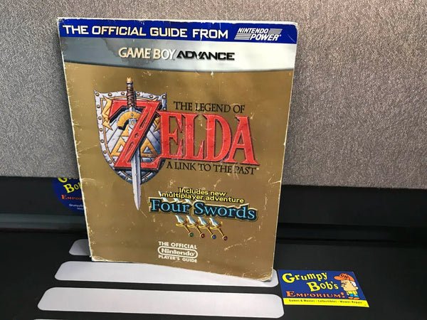 The Legend of Zelda: A Link To The Past (Four Swords) (Official Player's Guide) (Nintendo Power) Pre-Owned w/ Poster (Damaged) (As Pictured)