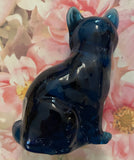 Fenton Art Glass / Sitting Cat / Indigo Blue Glass / Cherry Blossoms /  1985-1996 Fenton Label and Original Price, Catalog Number and Barcode Label on Bottom / Stamped with Fenton Logo in Glass / Approx. 3 3/4" / No Original Box (Pre-Owned)