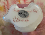 Fenton Art Glass / Sitting Cat / White Opalescent with Heart and Flowers / 1985-1996 Fenton Label / Stamped with Fenton Logo in Glass / Signed by Artist C. Smith / Approx 3 3/4" / No Original Box (Pre-Owned)