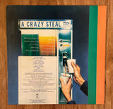 The Hollies "A Crazy Steal" / JE35334 Stereo / 1977 Epic Records / USA / (Vinyl)  Pre-Owned  (Orange Label)