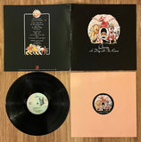 Queen: "A Day At The Races" / 6E-101 PRC Stereo / Custom (cardstock) inner sleeve ℗© 1976 Elektra/Asylum/Nonesuch Records All titles Pub. by Queen Music Ltd./Beechwood Music. Corp. BMI USA / (Gatefold/Vinyl)  Pre-Owned